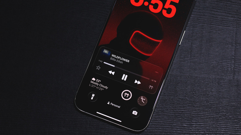 iOS 26 lock screen with Liquid Glass