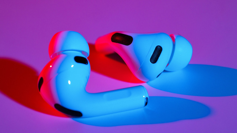A picture of Apple AirPods 3 with a colorful background