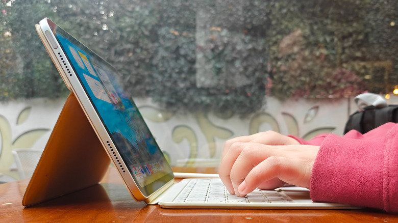 Typing on the iPad's keyboard.