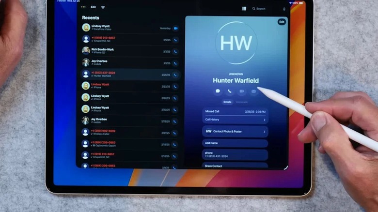 The Phone app displayed on an iPad, with a hand holding an Apple Pencil on the right side.