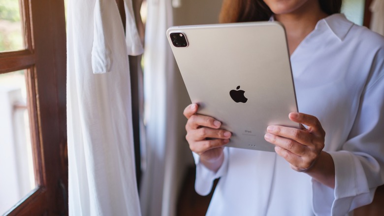 Woman holding an iPad Pro