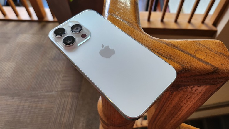 iPhone 14 Pro on a railing