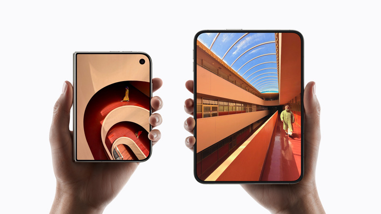 Pair of hands holding the Apple iPhone Duo folded and unfolded