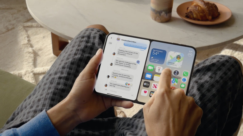 Person sitting down with using the Apple iPhone Duo