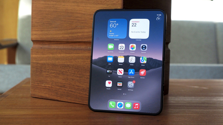 iPhone Duo unfolded, standing against a box