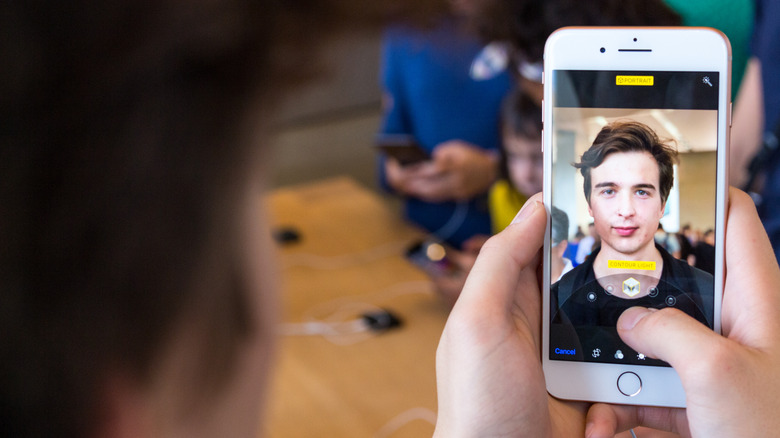 Person using their iPhone 