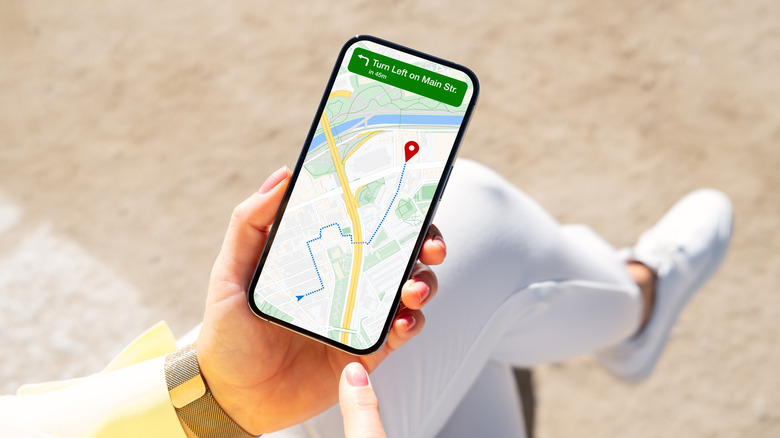 woman using map on smartphone