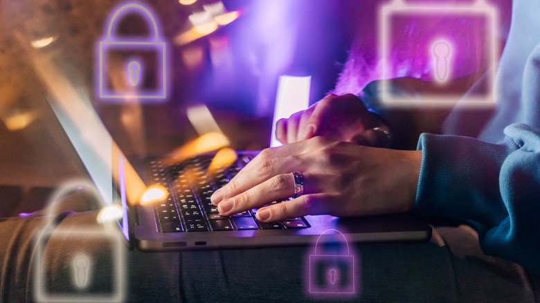 A woman adds security features onto her laptop.