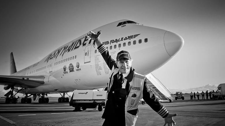 Bruce Dickinson poses in front of the Ed Force One, Iron Maiden Tour Plane