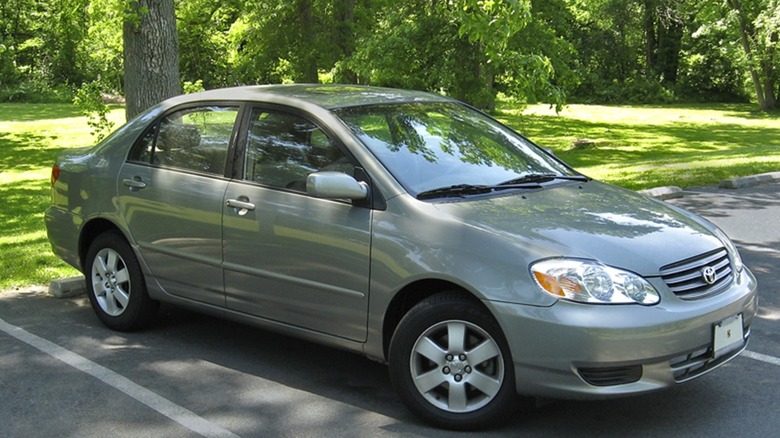 2003 silver Toyota Corolla in parking lot