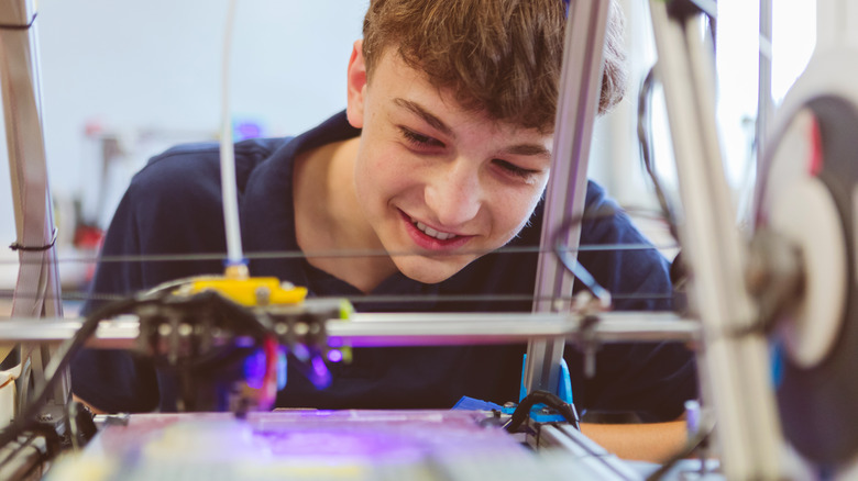 Person watching 3D printing