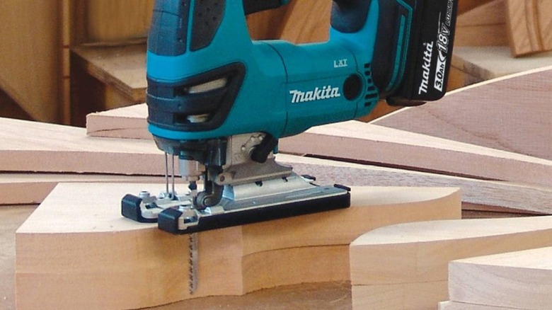Makita jigsaw on cut-out wooden blocks