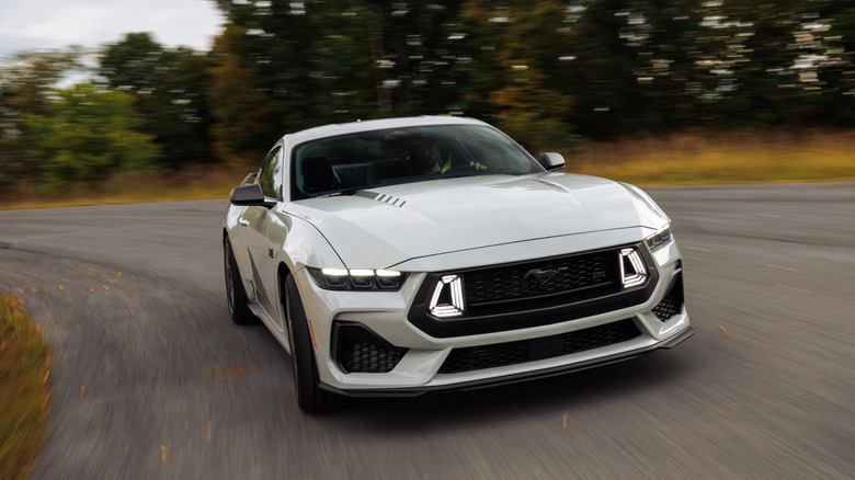 Front view of white Ford Mustang RTR on country road.