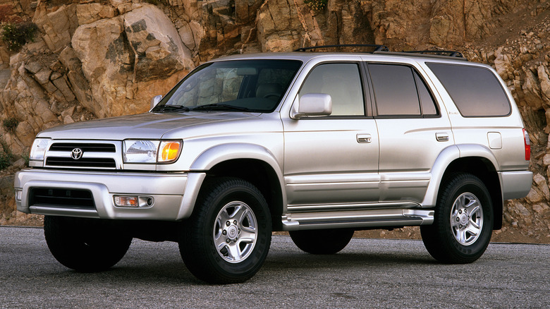 1996 Toyota 4Runner SUV parked in front of rocky mountain