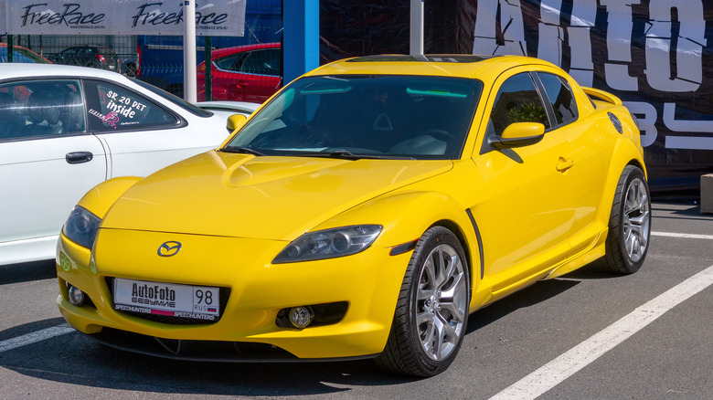 Yellow Mazda RX-8 parked