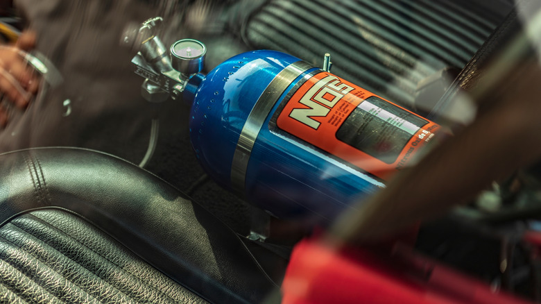 Detailed view of a NOS bottle setup within a car