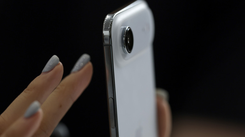 A person using an iPhone Air.