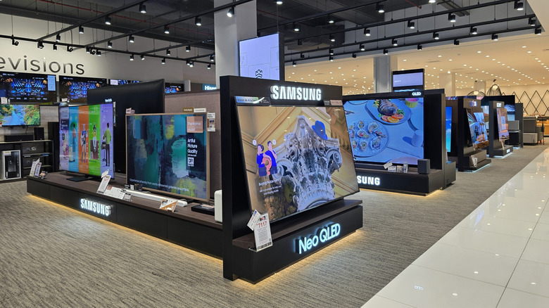 A store with a wide variety of large TVs
