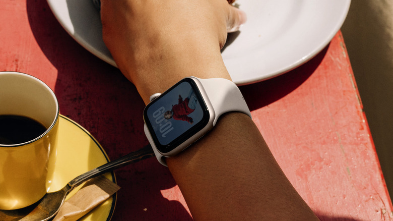 Person wearing an Apple Watch SE 3