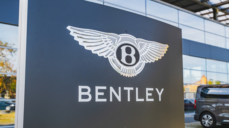 Bentley's logo displayed outside a dealership