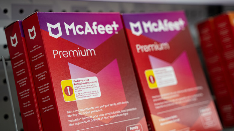 McAfee premium product boxes on a shelf.