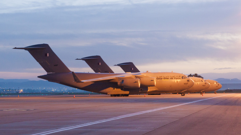Three Boeing C-17 Globemaster aircraft parked at a Turkish airbase