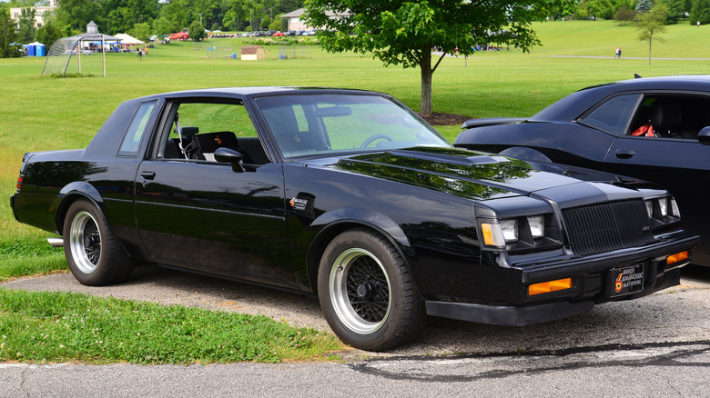 Front 3/4 view of black Buick Grand National parked at car show.