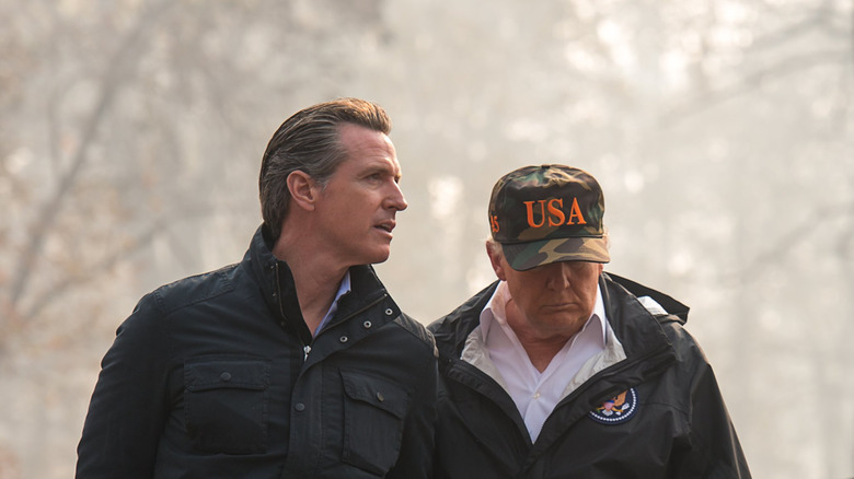 Then-California Lt. Gov. Gavin Newsom and President Donald Trump tour the site of the Camp Fire in Paradise, California in 2018.