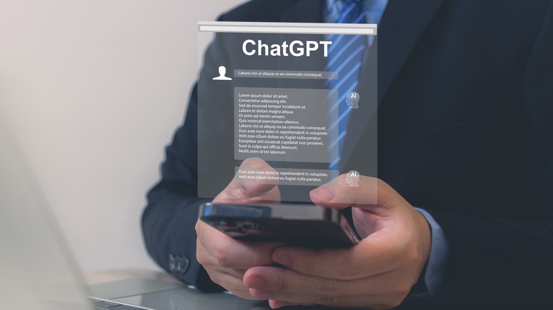 Businessperson using ChatGPT on smartphone 