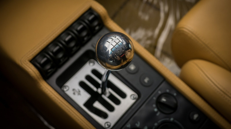 Close-up of chrome-plated gated six-speed manual transmission in center console