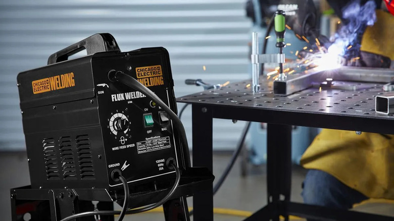 Chicago Electric welder with sparks flying in the background