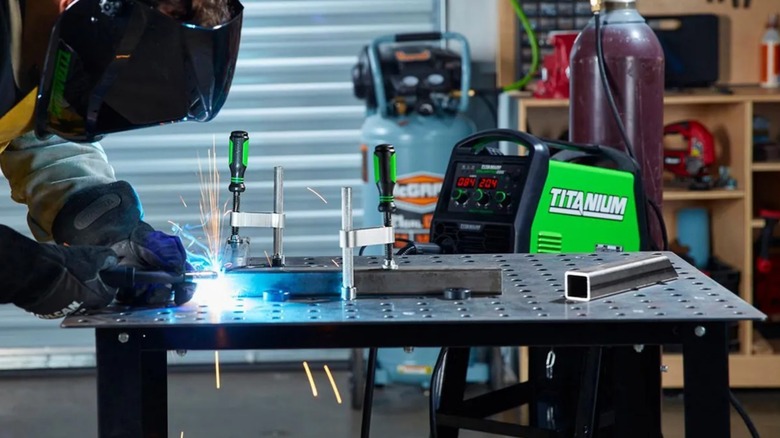 a person using the harbor freight titanium welding table