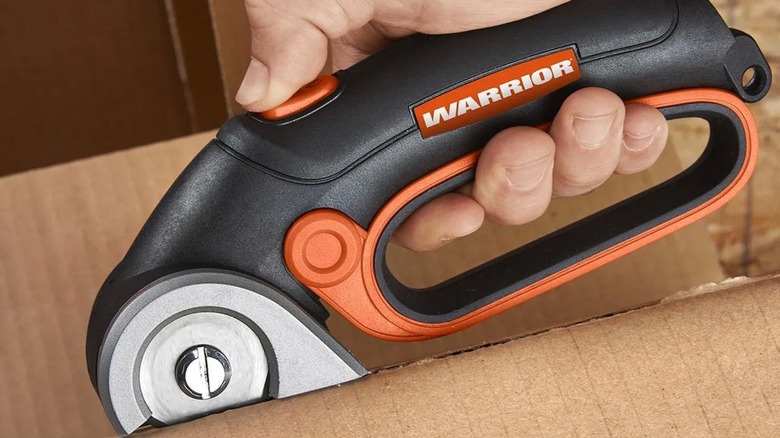 Warrior 4V Cordless Power Cutter cutting cardboard
