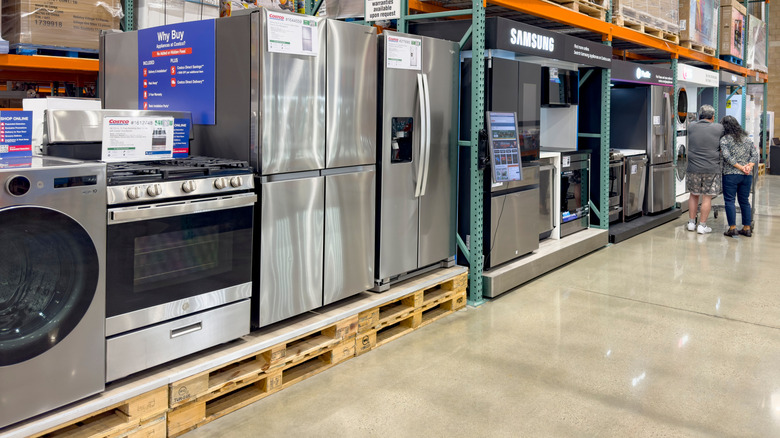 A disply of several varieties of electrical appliances as seen at Costco.