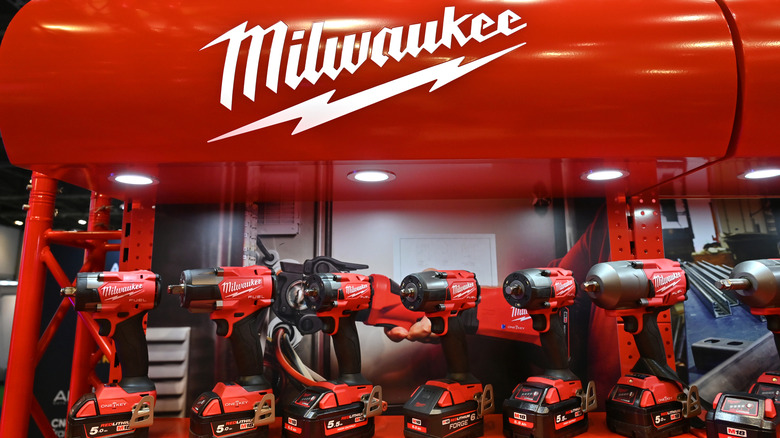 A Milwaukee tool display featuring multiple drills.
