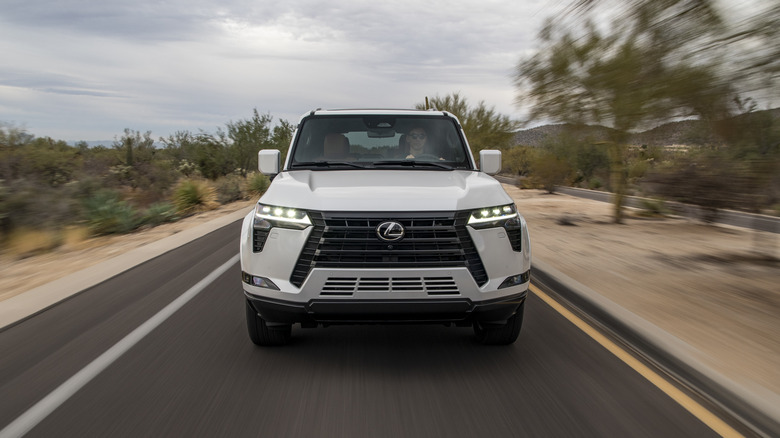 Front view of a white Lexus GX 550 on the move