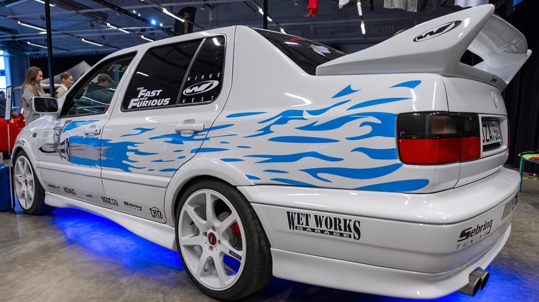A replica of The Fast and The Furious Volkswagen Jetta on display, rear 3/4 view