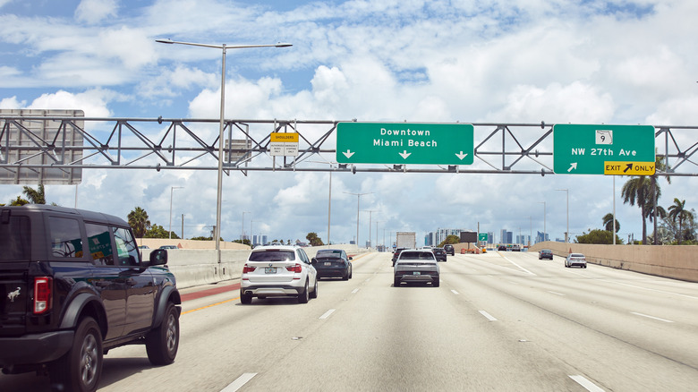 Miami, Florida, United States August 10 2025 Florida's Turnpike toll road near Miami with light traffic on a cloudy summer day.