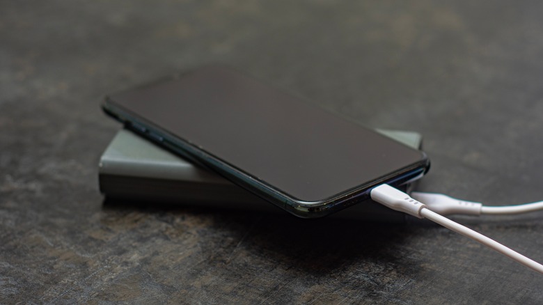 A phone charging on a power bank