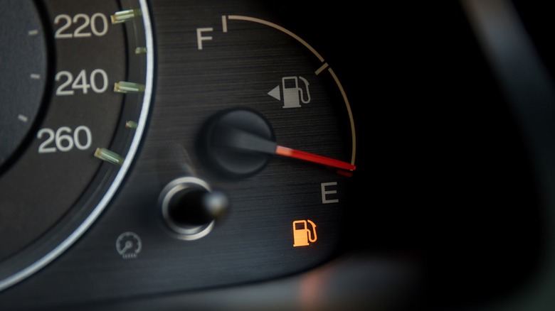 Fuel gauge of a car showing empty.
