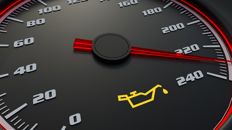 Oil light on speedometer of accelerating vehicle