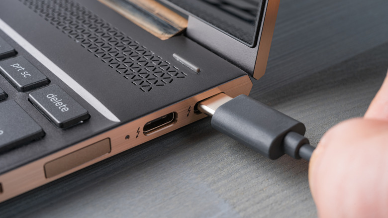 Image of a laptop's charging port and charger