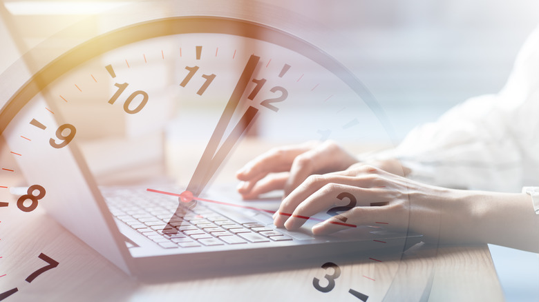 A clock and laptop superimposed on each other