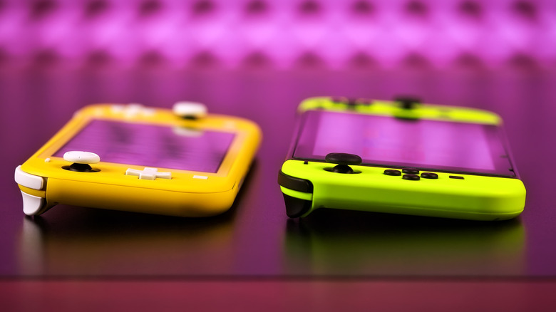 neon green Nintendo Switch next to a yellow Switch Lite