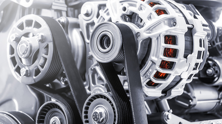 close up of engine serpentine belt and pulleys