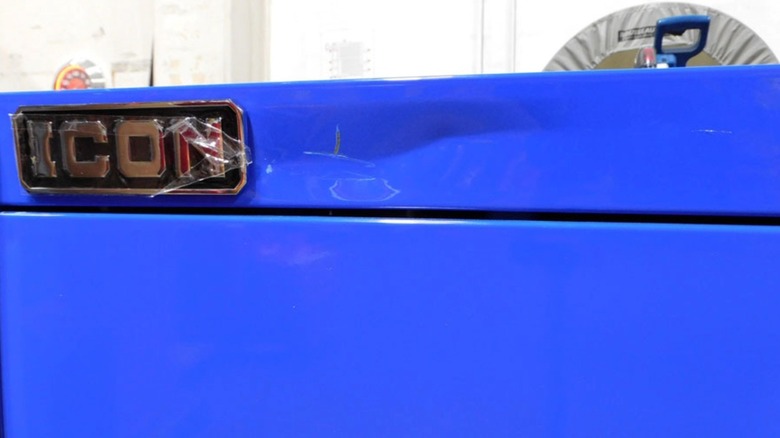 A Harbor Freight Icon toolbox with forklift damage.