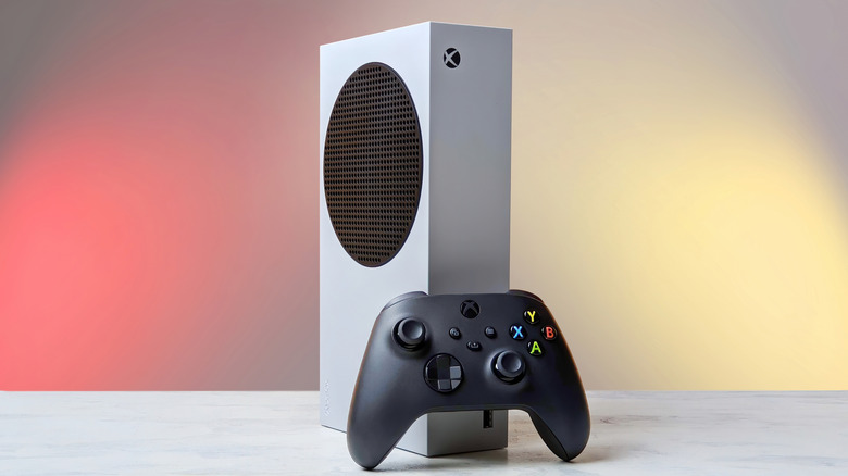 an Xbox Series S box with the controller placed on a white surface