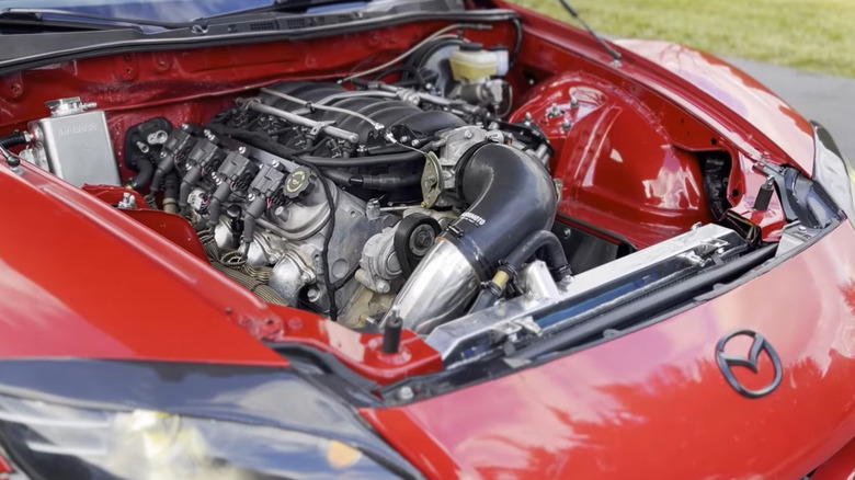 Front side-view of a red LS-swapped Mazda RX-8