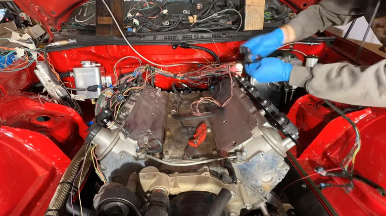 Close up of an LS engine dropped in a Mazda RX-8 engine bay