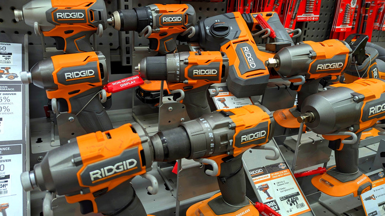 A shop display of orange Ridgid drills.